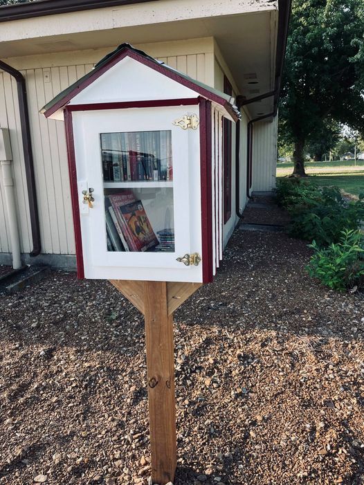 New community book share box with books inside